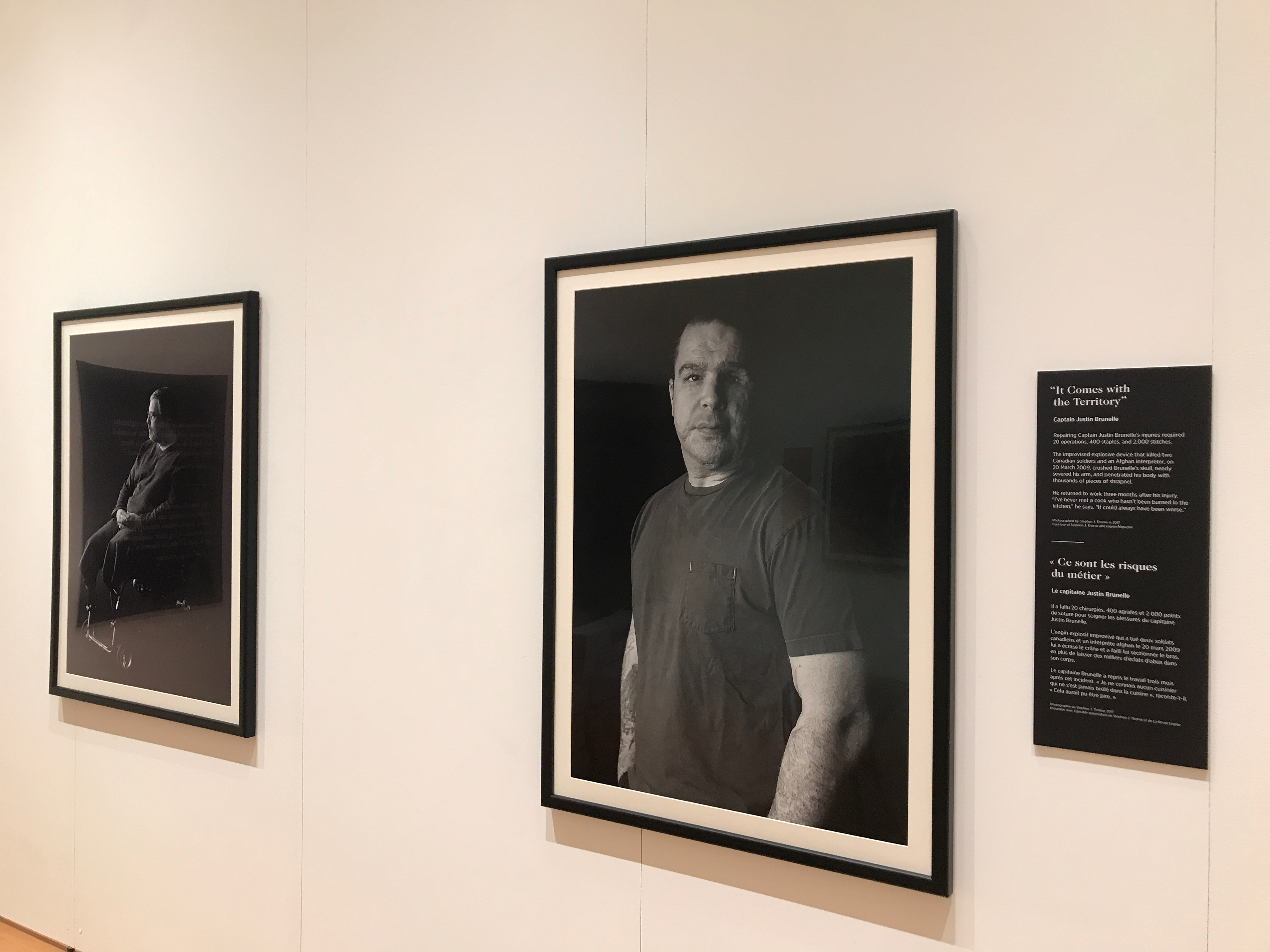 Image for The Wounded (installation view). Photography by Stephen J. Thorne and Legion Magazine, featuring (L-R) Major Mark Campbell and Captain Justin Brunelle. A travelling exhibition produced by the Canadian War Museum in partnership with Legion Magazine. 