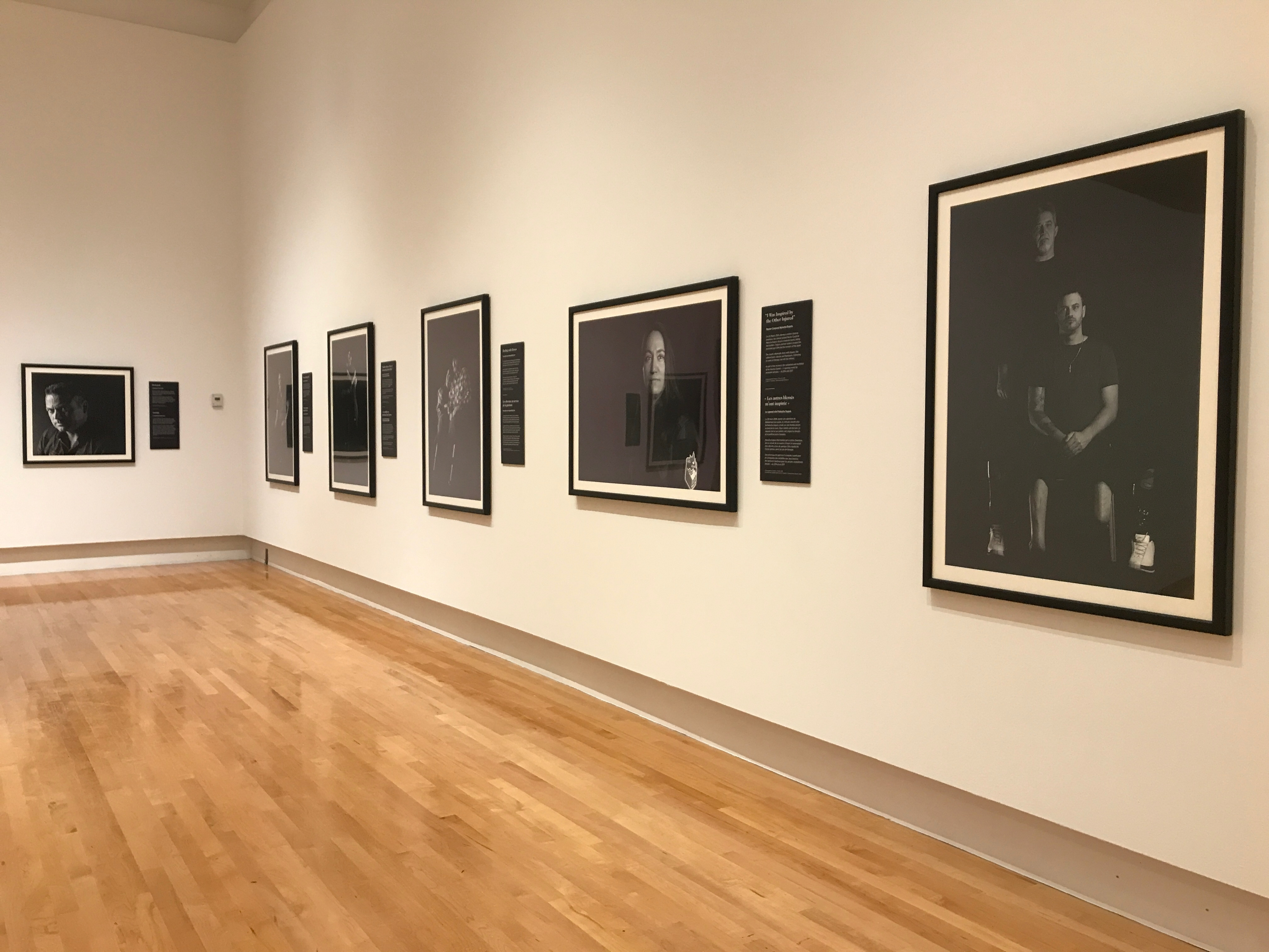 Image for The Wounded (installation view). Photography by Stephen J. Thorne and Legion Magazine, featuring multiple Canadian Forces personnel. A travelling exhibition produced by the Canadian War Museum in partnership with Legion Magazine. 